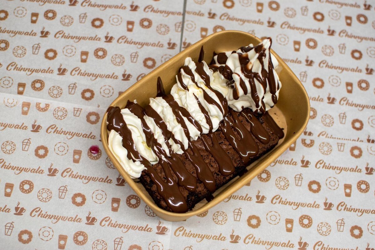 Chocolate Brownie with whipped cream and custard