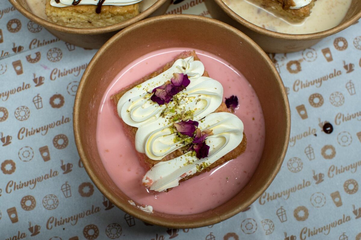 Rose Pistachio Milk Cake topped with crushed pistachio